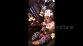 Cute hungry baby excited to try her first rib