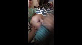 Peek a boo baby Dives off couch