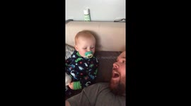 Adorable little boy cries listening to dad's high-pitched laugh