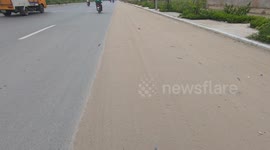 Worst and terrible road! A lane covered with sand and dirt on the road