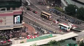 Crowds run away as Hong Kong police clash with protesters