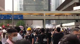 Police fire tear gas from above as protesters gather in Hong Kong