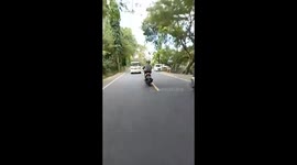 Tourist Steers Moped With Feet In Bali