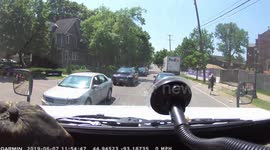 Unbelievable moment a runaway FedEx truck rolls down Minnesota street and crashes into a tree