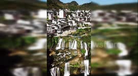Amazing drone footage showcases China’s ancient town built around waterfall