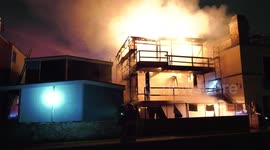 US firefighters battle huge fire at commercial building in Hermosa Beach, California
