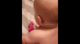 Baby laughing at daddy