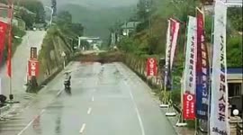 Massive landslide in China blocks highway seconds after motorcyclist drives past