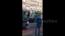 Man attacks New York bus with knife and swings from side-view mirrors