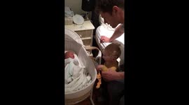 Adorable moment toddler meets his baby brother for the first time