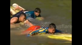 entering the school holiday period, children in Indonesia follow a banana tree raft competition