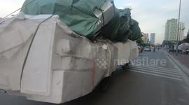 Motorcycle carries ridiculously overloaded foam boxes! Crazy motorcycle overload