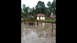 mud football chaos in Indonesia