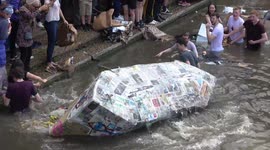 Boozed-up Cambridge University students celebrate end of exams with annual cardboard boat race