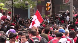 Thousands of fans wait for their basketball heroes at the Toronto Raptors victory parade