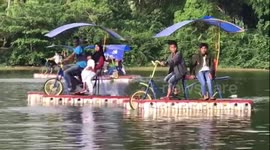play water bikes on the lake with beautiful sunset