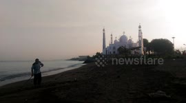 Cleaners clean the beach