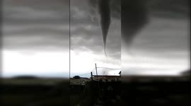 Footage of an intimidating tornado before it rips through Chinese village