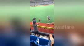Heartwarming moment baseball player Mike Trout throws a ball to an excited little boy