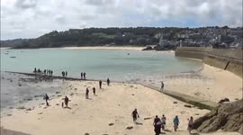 Sizzling St Ives basks in sunshine as rest of UK gets drenched