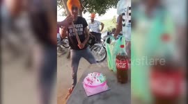 Knife is passe, boy uses garden spade to cut birthday cake in northern India