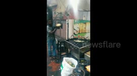 Skilled Chef Aims Potato Wafers Directly Into The Frying Pan From A Distance In Southern India