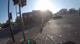 Helmet cam captures cyclist making fun of motorcyclists revving engines