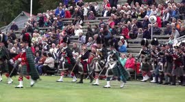 The massed pipes & drums lead the Queen & Royal family from the 2018 Braemar Gathering (4K)