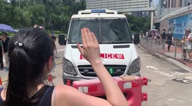Hong Kong protesters block police van