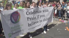 Barnardo’s holding banner during London Pride Parade