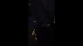 A couple fighting for an oyster card at Woolwich station