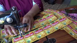 Sewing plastic waste into bags and aprons in Indonesia