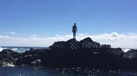 Epic fail. Guy falling down, because of slippery rock