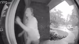 Doorbell cam catches moment woman slips and smacks door