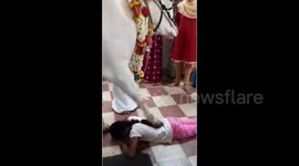 Devotees flock to the temple to seek blessings from a bull in southern India
