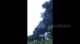 Huge clouds of black smoke rise from fire at industrial plant in Spain's San Roque