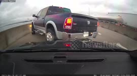 US truck driver 'fails to check blind spot' and slams into highway wall