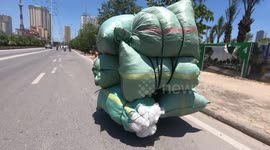 Self-moving sacks! Overload motorcycles carrying huge cargo sacks
