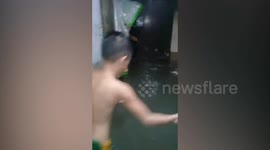 Homes submerged in water after heavy rain causes floods in the Philippines