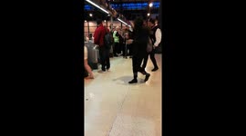 Guy kicking off with station staff, fight brawl