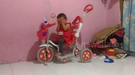 An embarrassed baby when she knows in a photo