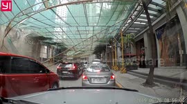 Shocking moment part of crane plunges 34 floors onto cars below in the Philippines