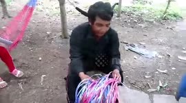 Father who couldn't afford to buy new rucksack for his son weaves one by hand from blue string
