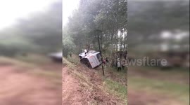 Truck knocks shuttle bus off road killing 2 and injuring 13 in China's Daqing