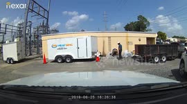 Funny moment Florida worker drops big battery after losing his footing