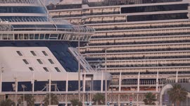 Huge cruise ship MSC Seaview arrives in Barcelona port at sunrise