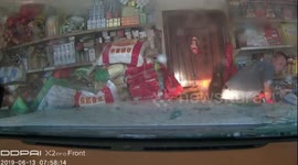 Inexperienced driver crashes into shop after avoiding motorcycle in China