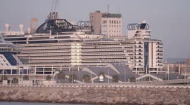 The large cruise ship MSC Seaview arriving into Barcelona port at sunrise