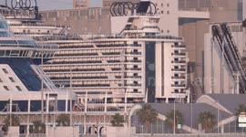 The large cruise ship MSC Seaview arriving into Barcelona port at sunrise