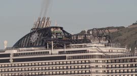 The large cruise ship MSC Seaview arriving into Barcelona port at sunrise